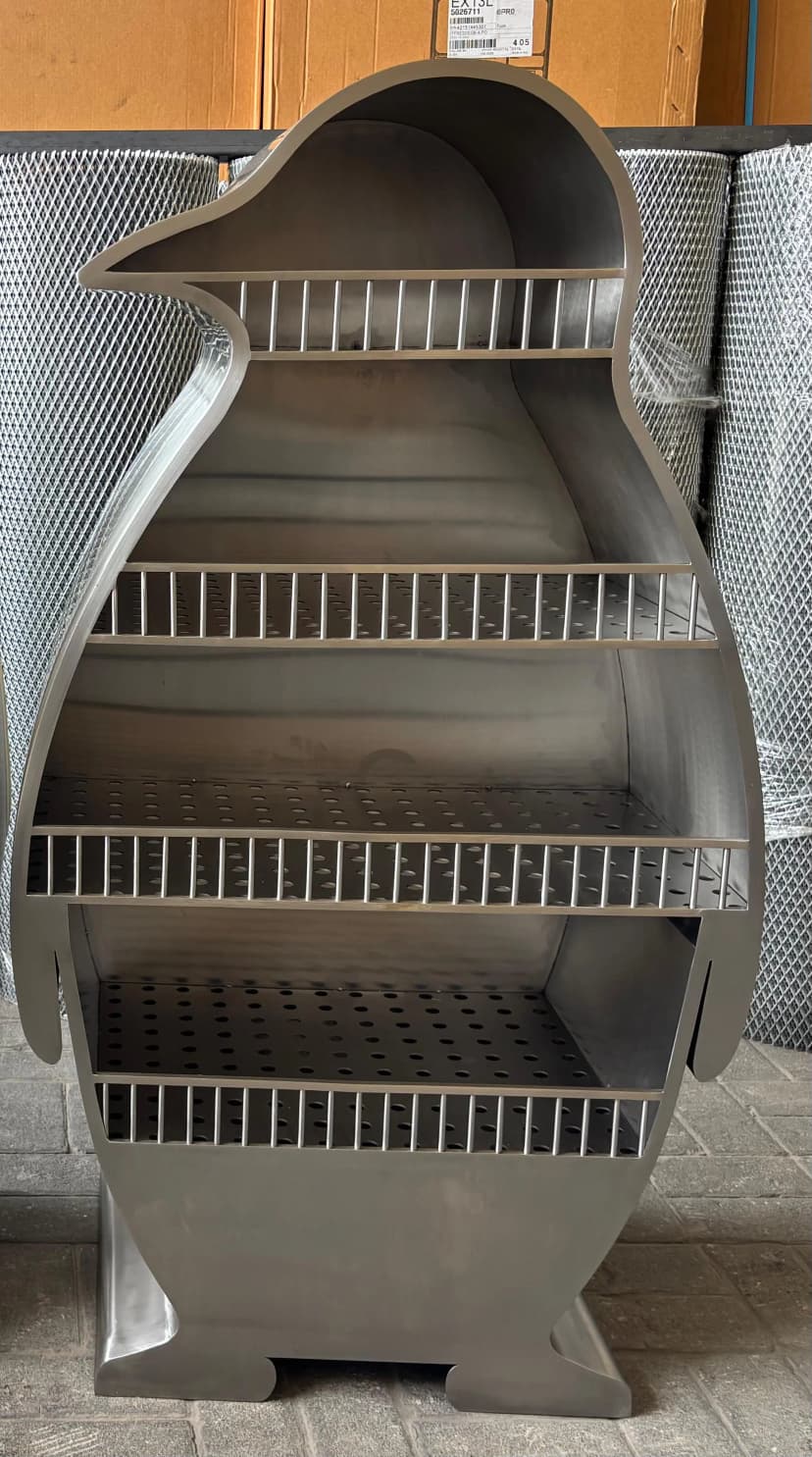 Custom fabricated penguin display shelf